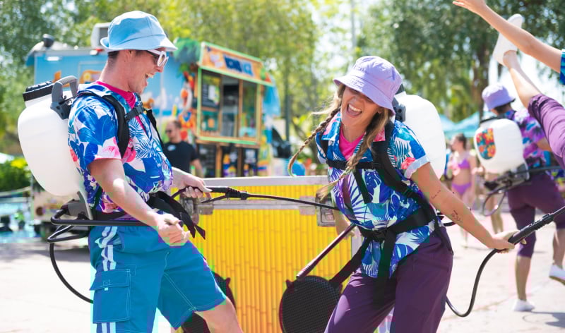Two performers with water spray devices