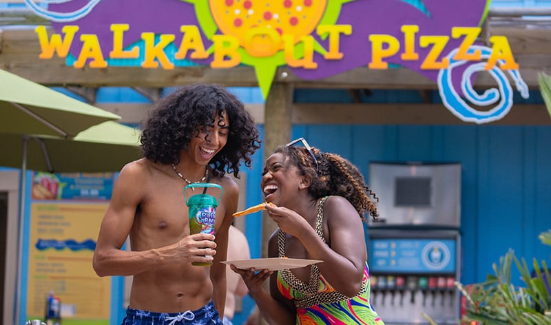 Guests in front of Walkabout Pizza at Aquatica Orlando