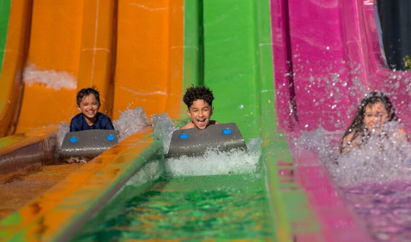 Kids going down a water slide at Aquatica Orlando